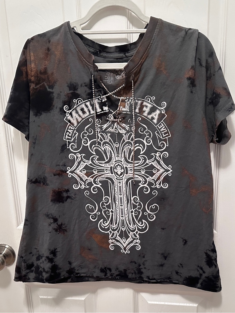 Affliction Teeshirt in Black with Rust Accents. Cristal stones lacing